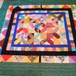 X's and O's - Hugs and Kisses - Approx. 60" x 70", professionally machine quilted - $125 plus $8.75 FL sales tax, plus $15 shipping