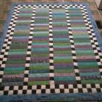 Finish Line - approx. 58" x 75" and is hand quilted. - $150 plus $10.50 FL sales tax plus $15 postage