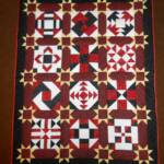 Black/Red Sampler - approx. 44" x 56" and is hand quilted.  $100 plus $7 FL sales tax plus $10 shipping